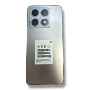 Back view of a silver smartphone with a rectangular quad-camera module in the top-left corner and a label on the back panel, no visible branding mentioned.