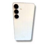 Back of a white smartphone with three camera lenses arranged vertically in the top-left corner and a small flash between them