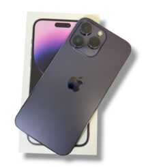 Dark blue iPhone with triple-camera back resting on its box, angled to show cameras and Apple logo on a white background.