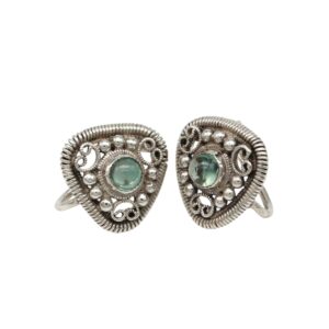 Pair of vintage silver heart-shaped earrings with green cabochon stones and intricate filigree detailing as focal points in the center.