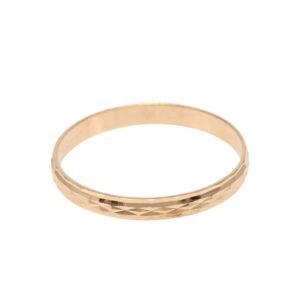 Gold-toned band ring with a faceted, diamond-cut texture on the surface