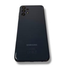 Back of a dark Samsung smartphone with a quad-camera setup in the top-left corner.