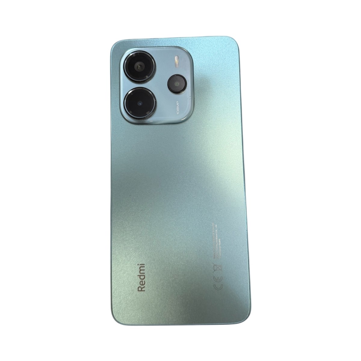 786e6a1b4dee67f37b6ce7c8efe7890ajpg - Mezola OÜ Blue-green gradient back of a Redmi smartphone with a square triple-camera module in the top-left corner.