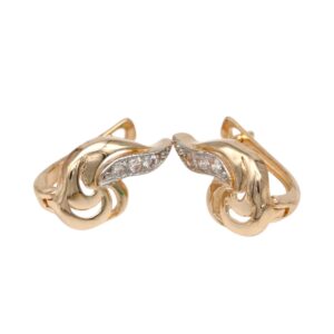 Pair of gold knot earrings with pavé diamonds along the inner curve