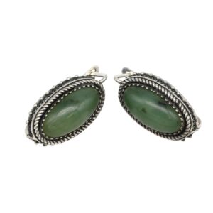 Silver oval earrings with green cabochon stones set in a twisted rope bezel and dotted edge.