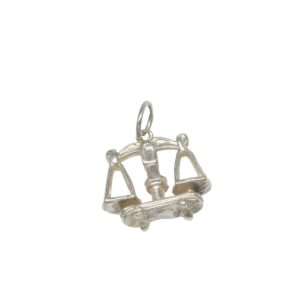 Silver charm shaped like the scales of justice with a central gavel motif, a legal-justice pendant