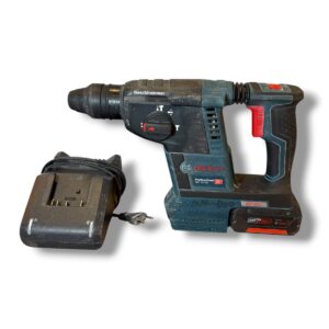 Cordless Bosch drill with battery pack and charging dock on a white background, used for drilling tasks.