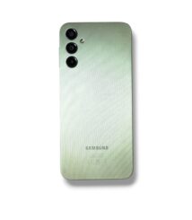 Back view of a green Samsung smartphone with a vertical triple-camera module and brushed metal finish.