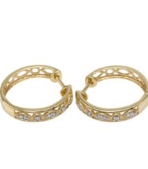 Gold hoop earrings with a lattice cutout design and small diamonds along the front arc