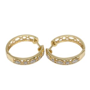 Gold hoop earrings with a lattice cutout design and small diamonds along the front arc