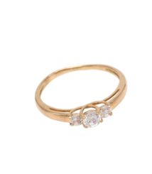 Gold ring with three clear stones arranged in a decorative cluster on the band