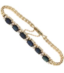 Gold bracelet featuring oval blue gemstones set along a linked band with diamond accents on each setting