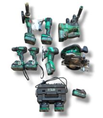 Collection of green Hikoki cordless power tools with charger and batteries laid out on white background.