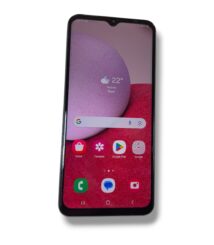 Smartphone angled upright, showing home screen with weather widget and app icons on pink-red wallpaper