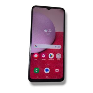 Smartphone angled upright, showing home screen with weather widget and app icons on pink-red wallpaper