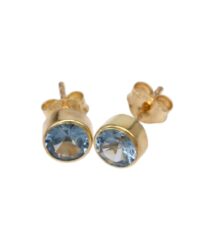 Gold stud earrings with light blue round-cut gems set in smooth bezels on a gold backing.