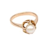Rose gold ring with a white pearl set in a floral bezel motif.